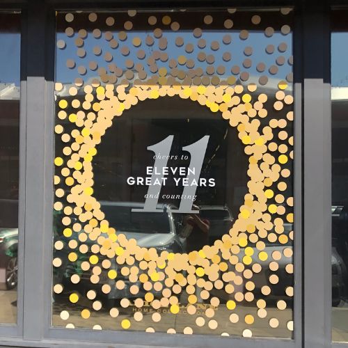 window-graphics-sign-shop-midvale-utah Business storefront with custom window graphics in Midvale, Utah